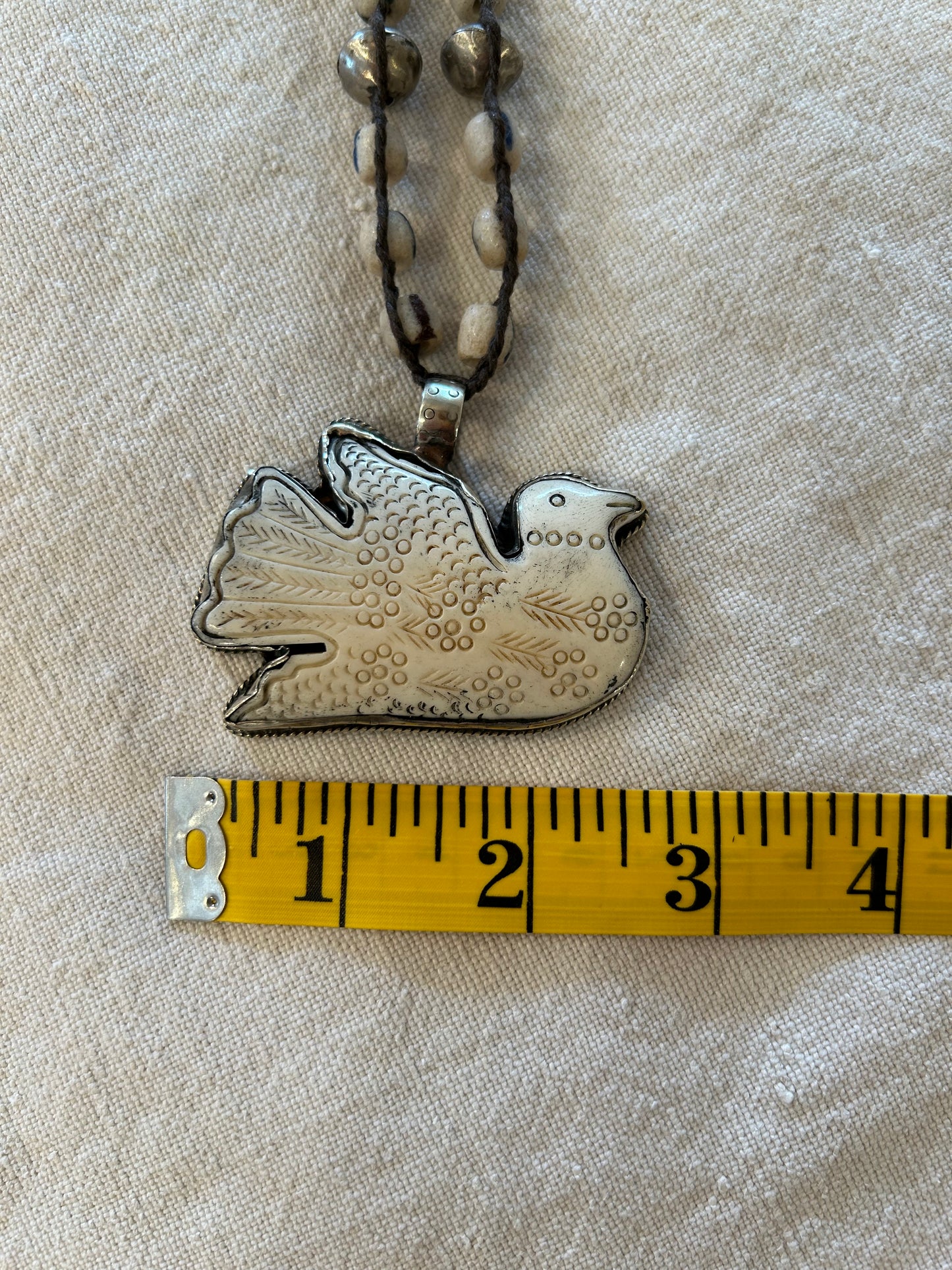 carved dove trade beaded necklace