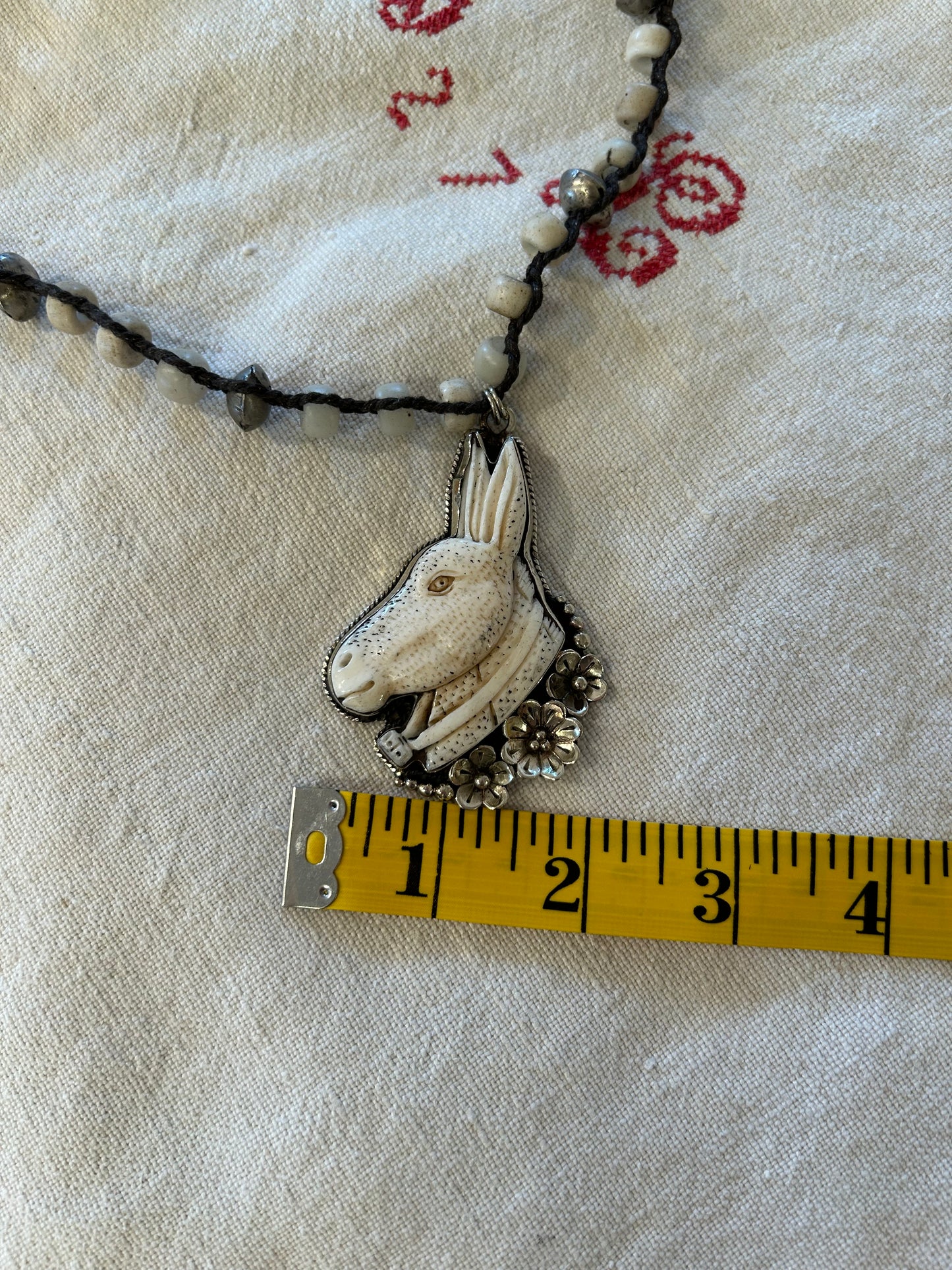 carved bone donkey necklace