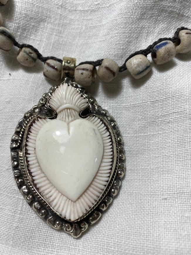 carved bone heart necklace with trade beads