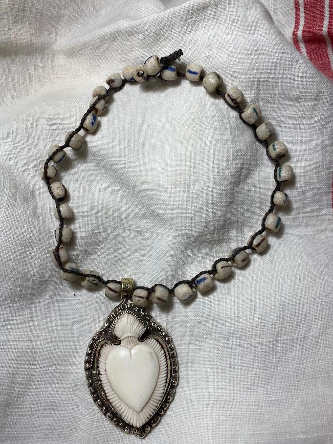 carved bone heart necklace with trade beads