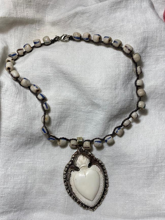 carved bone heart necklace with trade beads