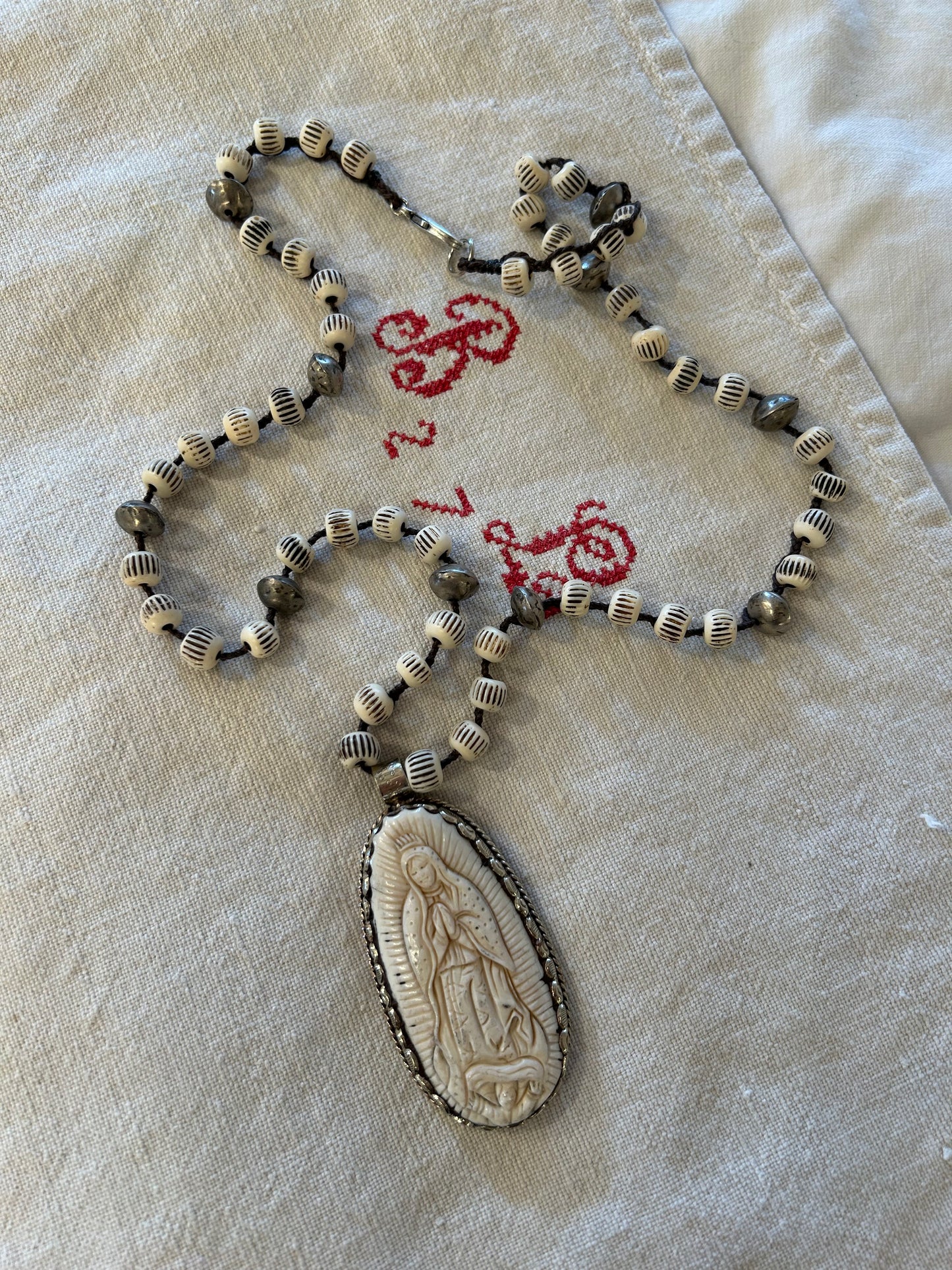 carved bone guadalupe beaded necklace