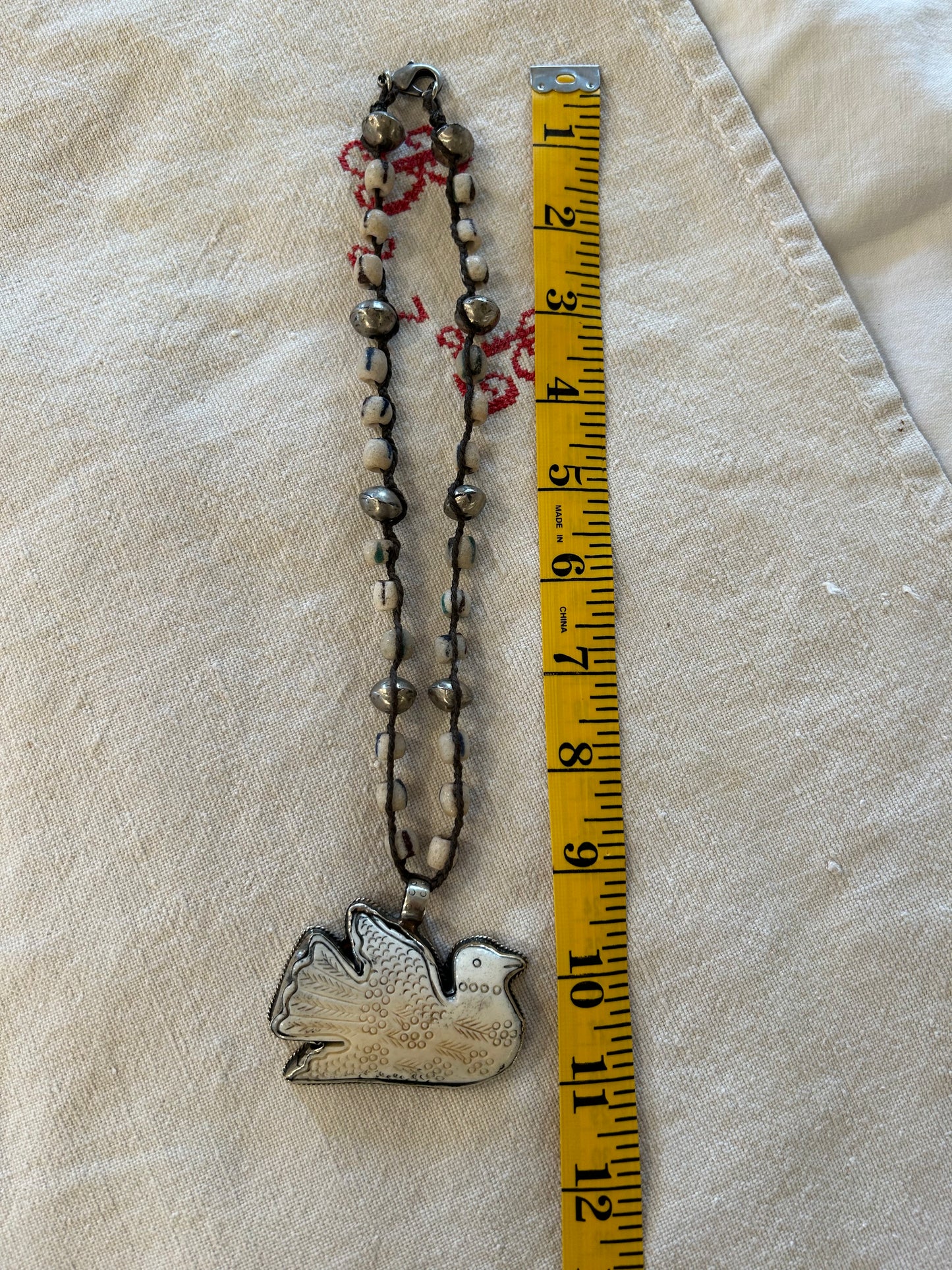 carved dove trade beaded necklace