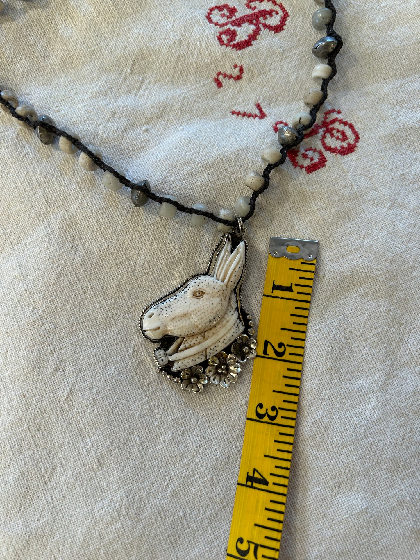 carved bone donkey necklace